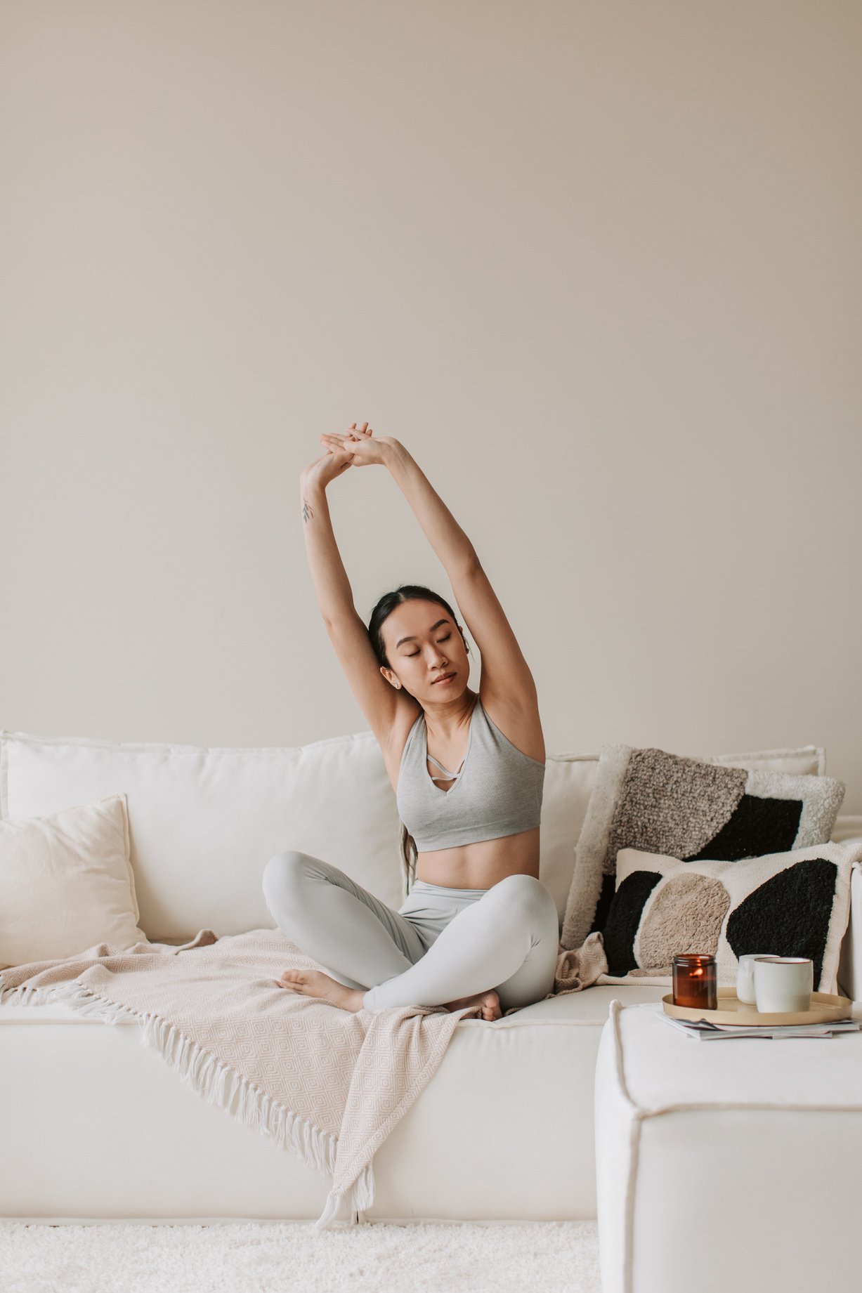 Woman Stretching Her Arms at Home